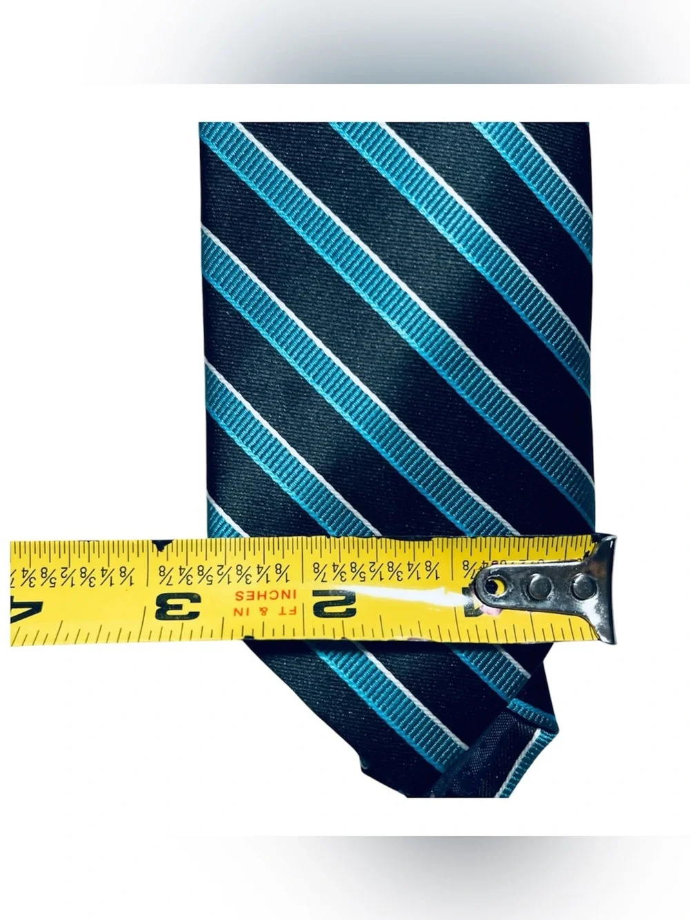 Pierre Cardin slim necktie featuring a contemporary striped design.